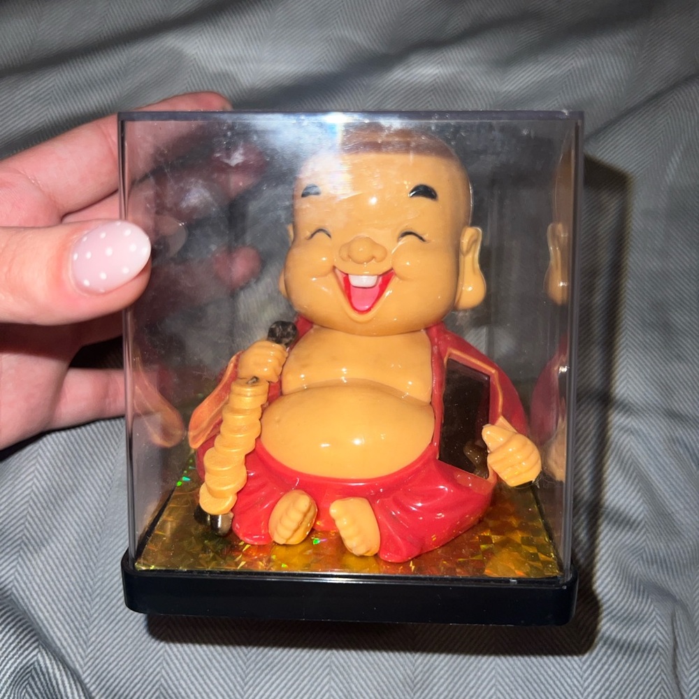 Red and Gold Action Figure with Cheerful Expression